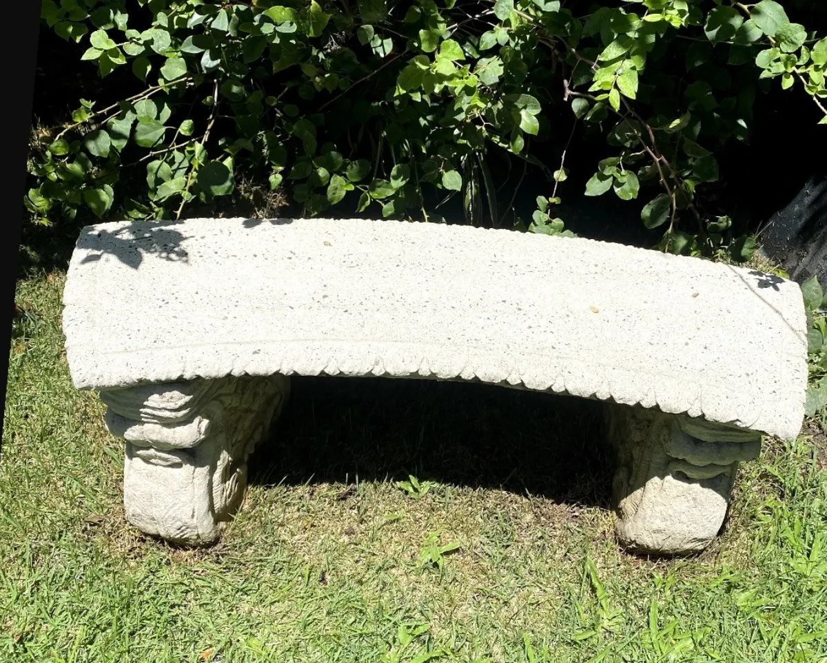 Stone garden bench after cleaning — restored pale sandstone finish