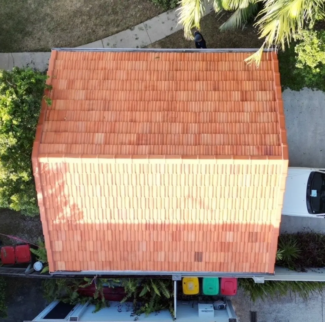 Terracotta roof after cleaning — fully restored orange tiles